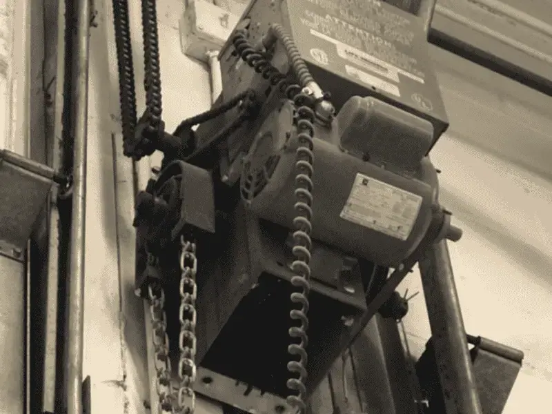 Garage door opener and lifting system being inspected